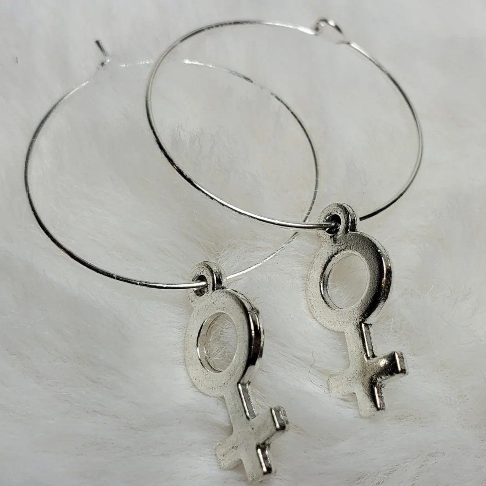 Female gender sign earrings
